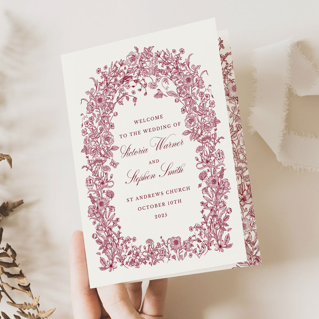 wedding order of service booklet with burgundy florals