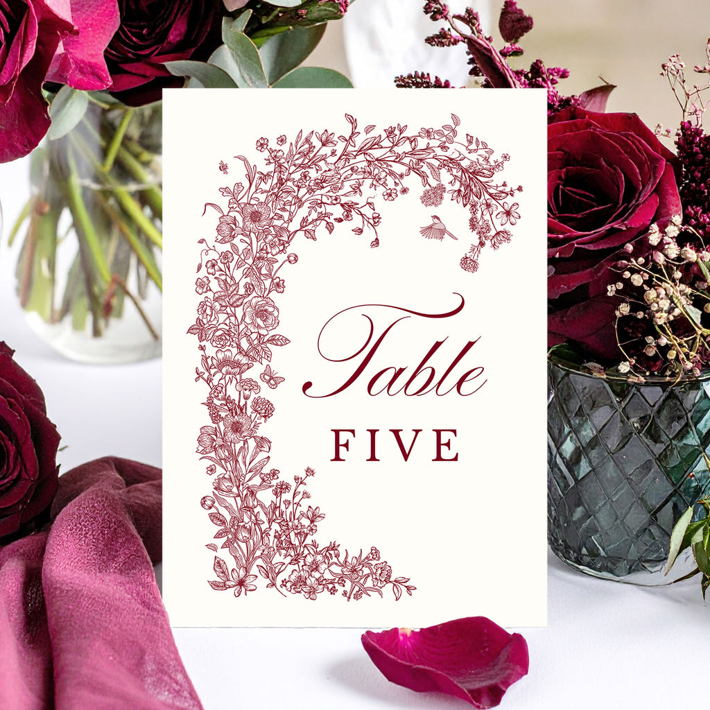 wedding table number with a burgundy floral design and elegant text