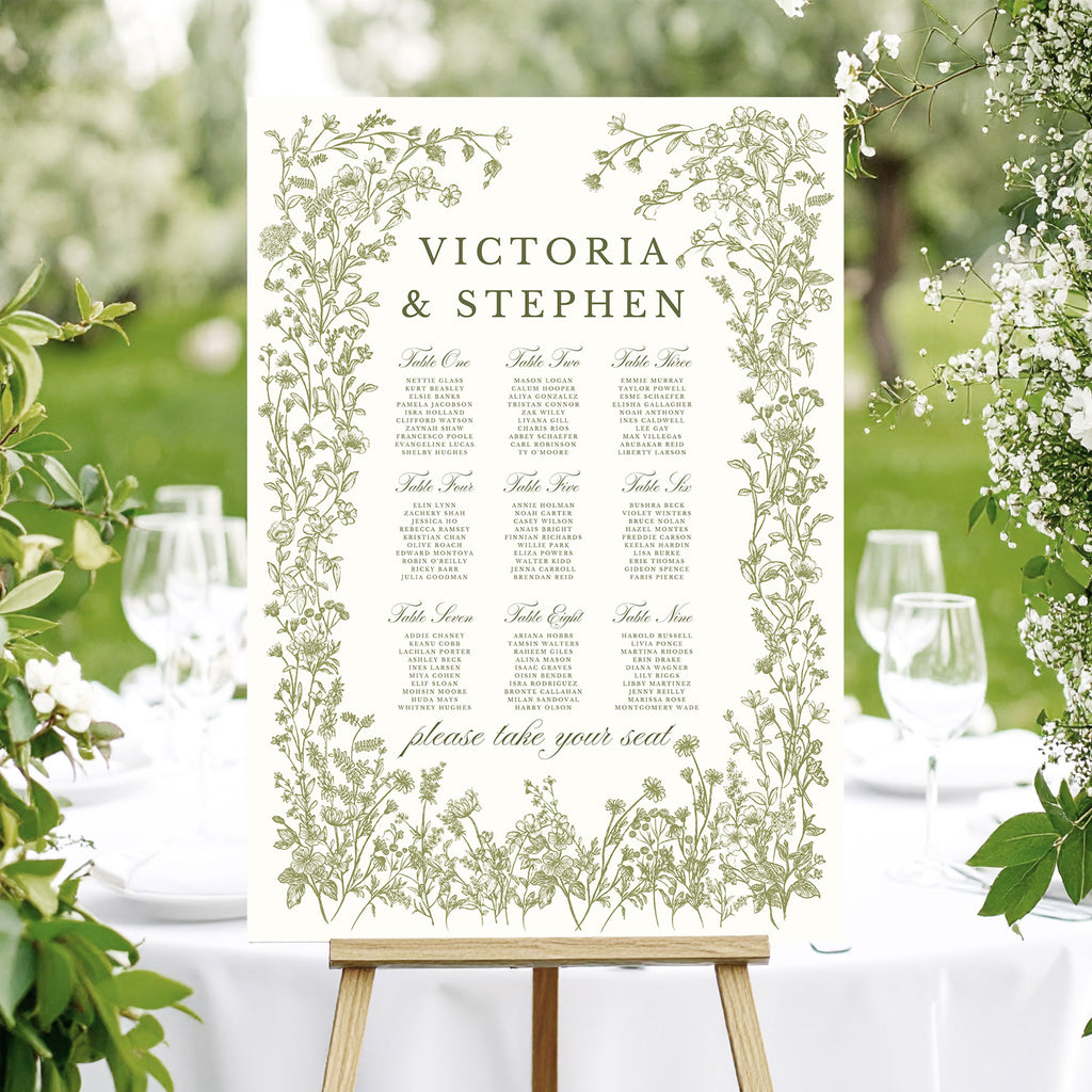 wedding table plan with elegant green foliage and wildflowers