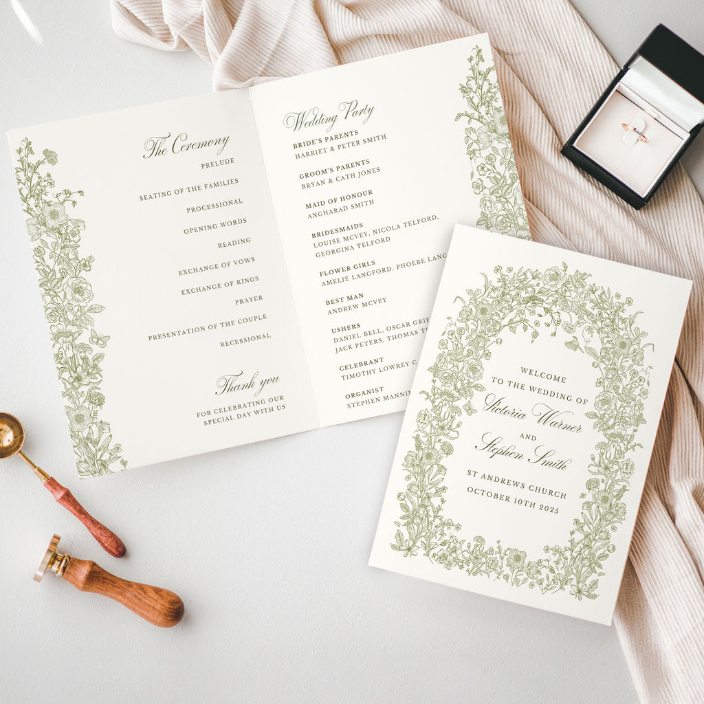 wedding folded order of service featuring a wildflower and green foliage arch surrounding the text