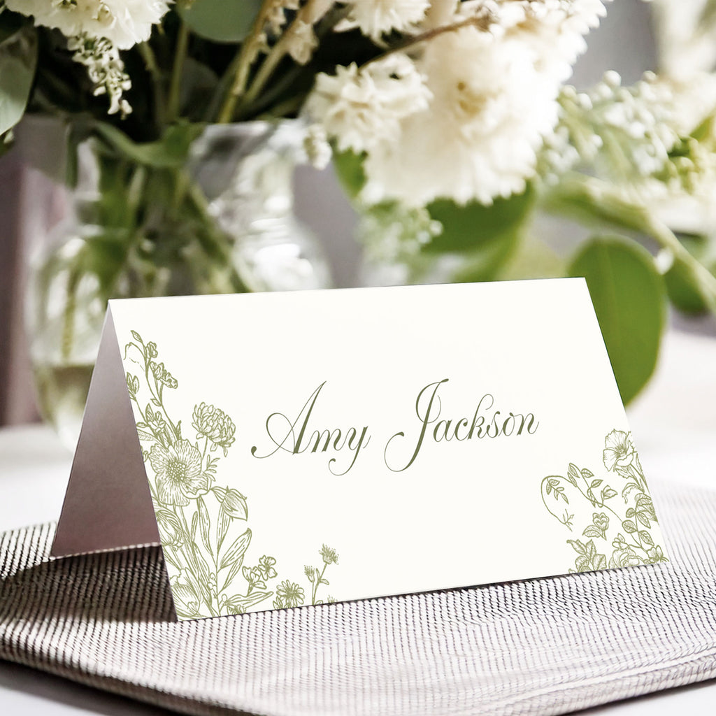 folded name card with elegant green foliage