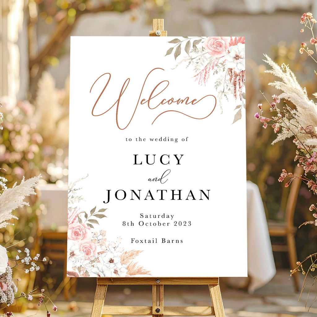 Wedding welcome sign with a neutral floral design with dried flowers, pampas and roses in blush pink
