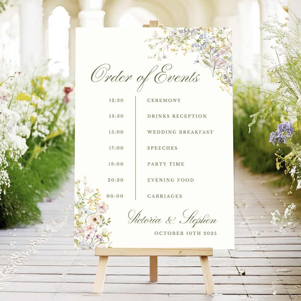wedding order of events sign with pastel wildflowers and wedding timeline